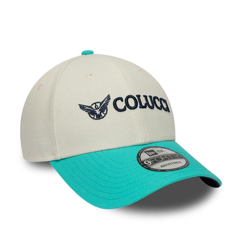 Colucci X New Era White 9FORTY Adjustable Cap, three-quarter view showing the black embroidered Colucci logo on the front panels, light turquoise curved visor with a 9FORTY size sticker, and a matching top button.