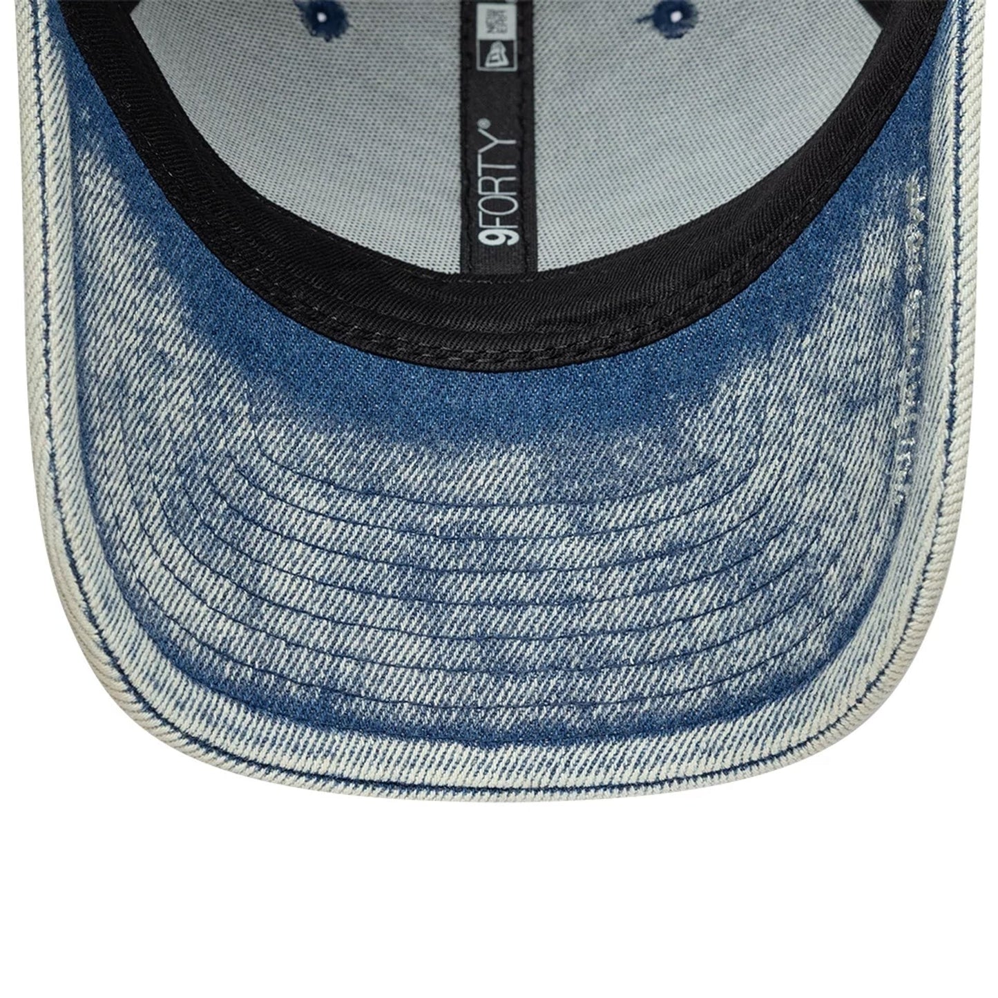 New Era X Zadig & Voltaire Pastel Blue 9FORTY Adjustable Cap, inside view showing the black sweatband, grey taping, and denim-style pattern on the blue undervisor, with blue stitched eyelets on the fabric.