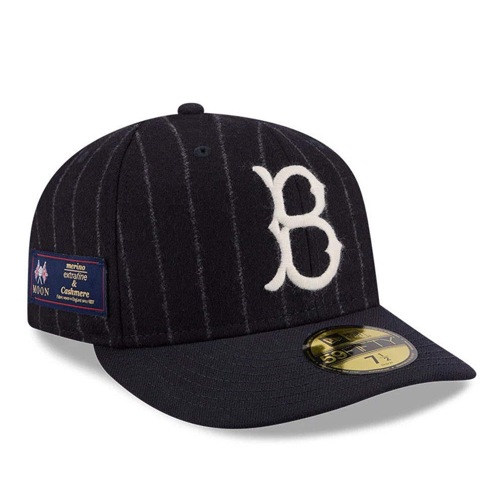 Brooklyn Dodgers MLB X Moon Navy New Era 59FIFTY Fitted Cap, three-quarter view showing a white embroidered Brooklyn B on the front panel, a navy flat visor with a gold 59FIFTY size sticker, and a Moon label on the side.