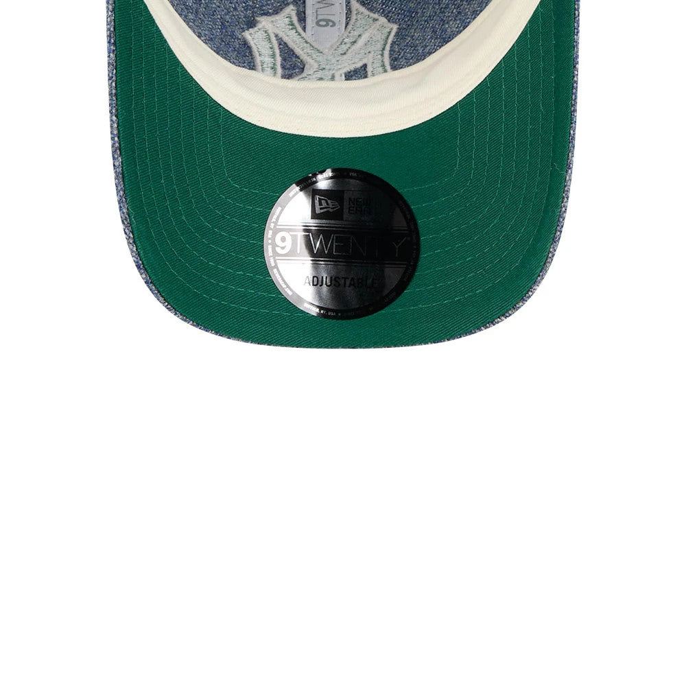 New York Yankees MLB X Moon Blue New Era 9TWENTY Adjustable Cap, inside view featuring a green undervisor with a 9TWENTY size sticker and a white and denim embroidered team logo on the front panel.