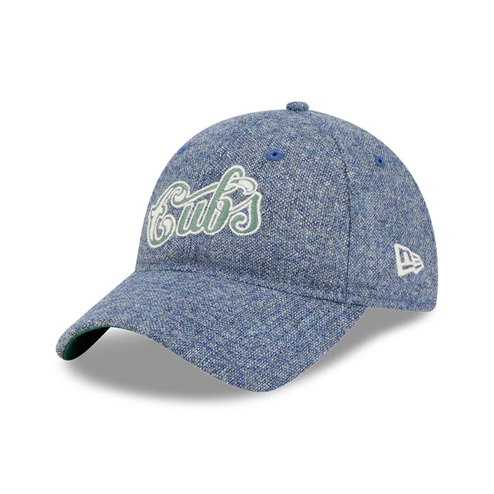 Chicago Cubs MLB X Moon Blue New Era 9TWENTY Adjustable Cap, three-quarter view showing the white and blue embroidered Cubs script logo on the front panel, a curved blue visor, and the white New Era flag logo on the left side.
