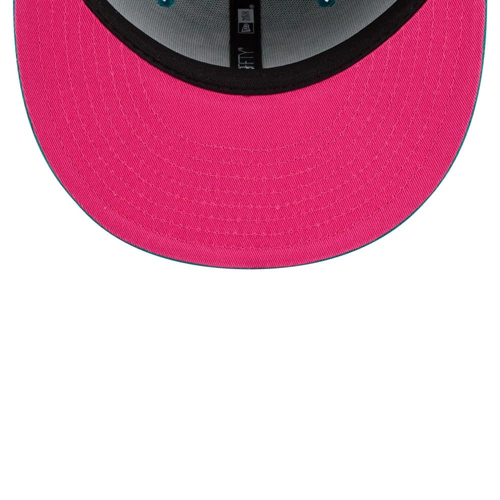 Netflix Squid Game Green New Era 59FIFTY Fitted Cap, inside view showing bright pink undervisor, black sweatband, and grey interior taping with New Era branding, highlighting a contrast between the pink and green elements.