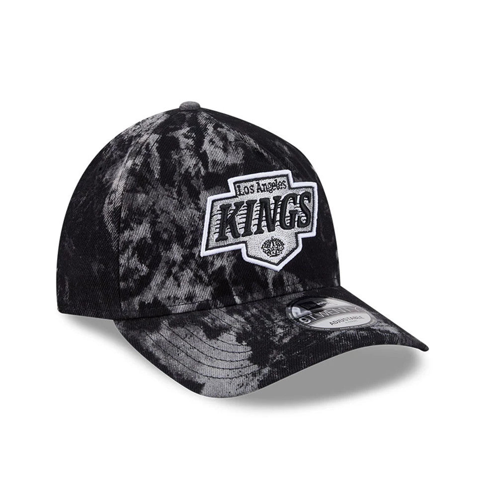 LA Kings NHL Bleached Denim Black New Era 9TWENTY A-Frame Adjustable Cap, three-quarter view with a white and black raised Kings logo on the front panel, bleached denim pattern, and 9TWENTY size sticker on the curved visor.
