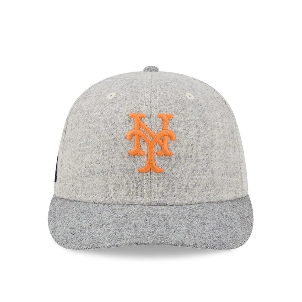 New York Mets MLB X Moon Light Beige New Era 59FIFTY Fitted Cap, front view showing the raised orange New York Mets logo on the structured beige crown, with a textured grey visor and matching top button.