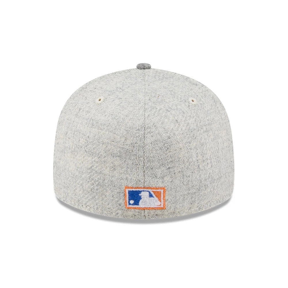 New York Mets MLB X Moon Light Beige New Era 59FIFTY Fitted Cap, rear view showing the MLB Batterman logo embroidered in blue and orange at the centre of the light beige back panels, with two white eyelets and a matching top button.