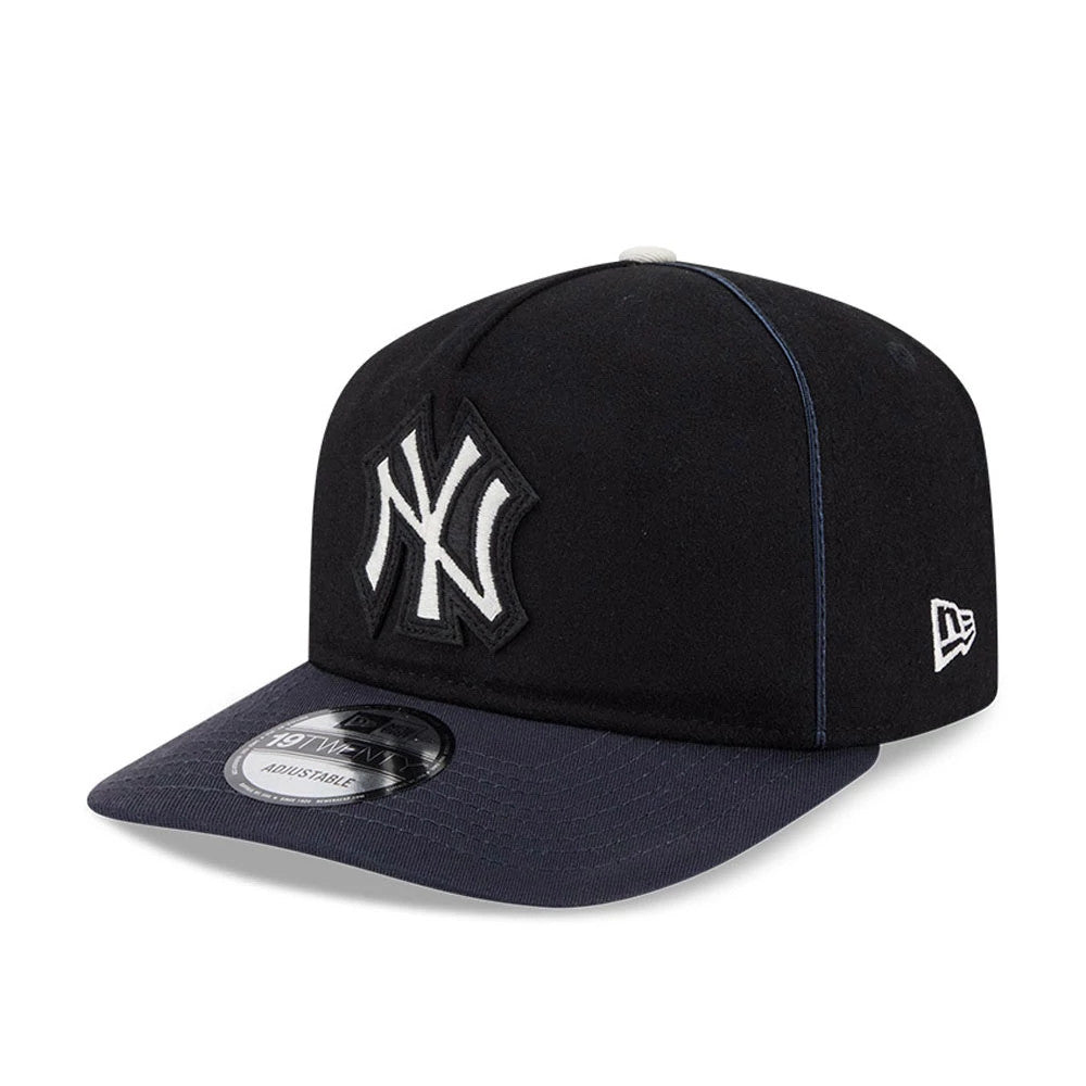 New York Yankees MLB Felt Logo Navy New Era 19TWENTY Adjustable Cap, three-quarter view showing the raised white felt NY logo on the front panel, a navy visor with a 19TWENTY size sticker, and the New Era flag logo embroidered on the left side.