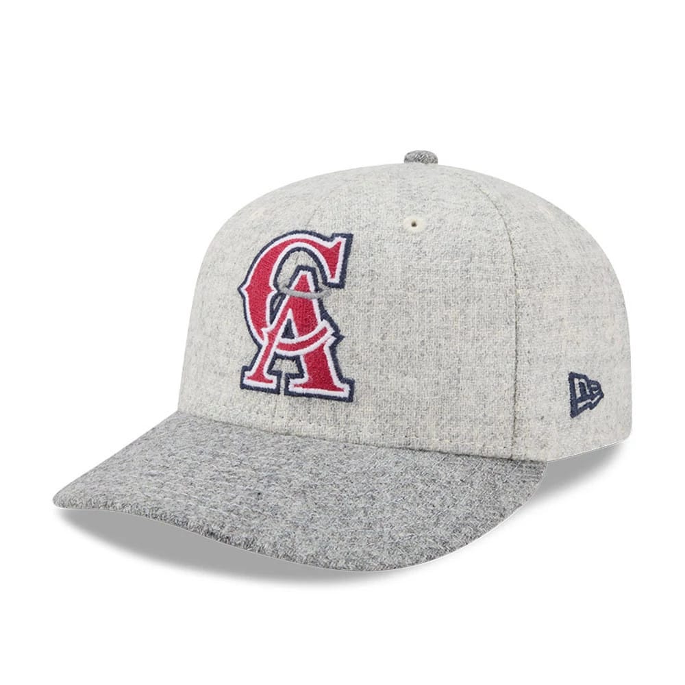 LA Angels MLB X Moon Light Beige New Era 59FIFTY Fitted Cap, three-quarter view showing the raised red and navy embroidered team logo on the front panel, with a grey visor and blue New Era flag logo on the left side.