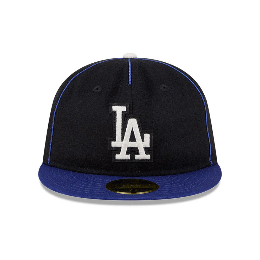 LA Dodgers MLB Felt Logo Dark Blue Retro Crown New Era 59FIFTY Fitted Cap, front view showing a white embroidered LA logo on the black crown with a dark blue flat visor and a gold 59FIFTY size sticker.