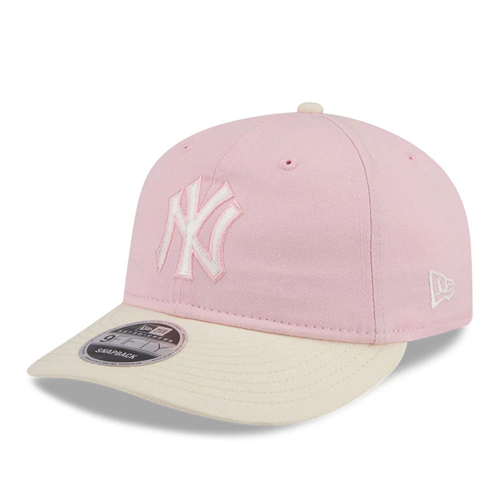 New York Yankees MLB Washed Tie Dye Pastel Pink New Era 9FIFTY Snapback Adjustable Cap, three-quarter view showing white raised embroidery of the NY logo on the front panel, cream visor with a 9FIFTY size sticker.