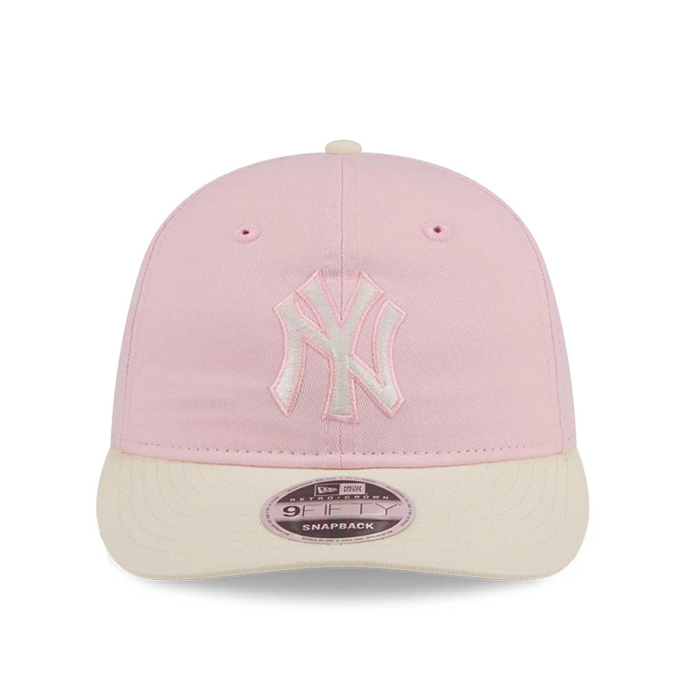 New York Yankees MLB Washed Tie Dye Pastel Pink New Era 9FIFTY Snapback Adjustable Cap, front view showing the pink embroidered NY logo on the pastel pink crown, with a cream visor and a 9FIFTY size sticker.