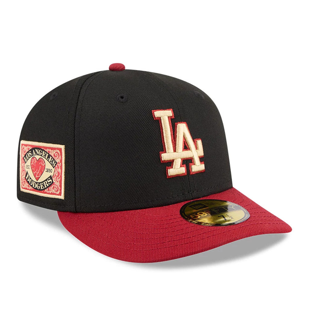 LA Dodgers MLB Team Cards Black New Era 59FIFTY Fitted Cap, front view showing a prominent raised embroidery LA logo in cream and red on the black crown, with a matching red visor including a gold 59FIFTY size sticker centred on the visor.