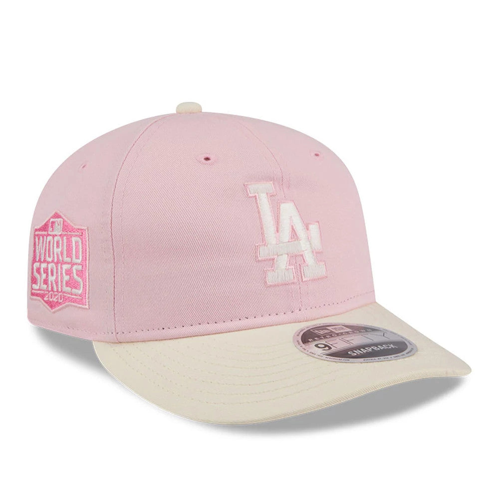 LA Dodgers MLB Washed Tie Dye Pastel Pink New Era 9FIFTY Snapback Adjustable Cap, three-quarter view showing the white embroidered LA logo on the front panel, a light pink World Series patch on the side.