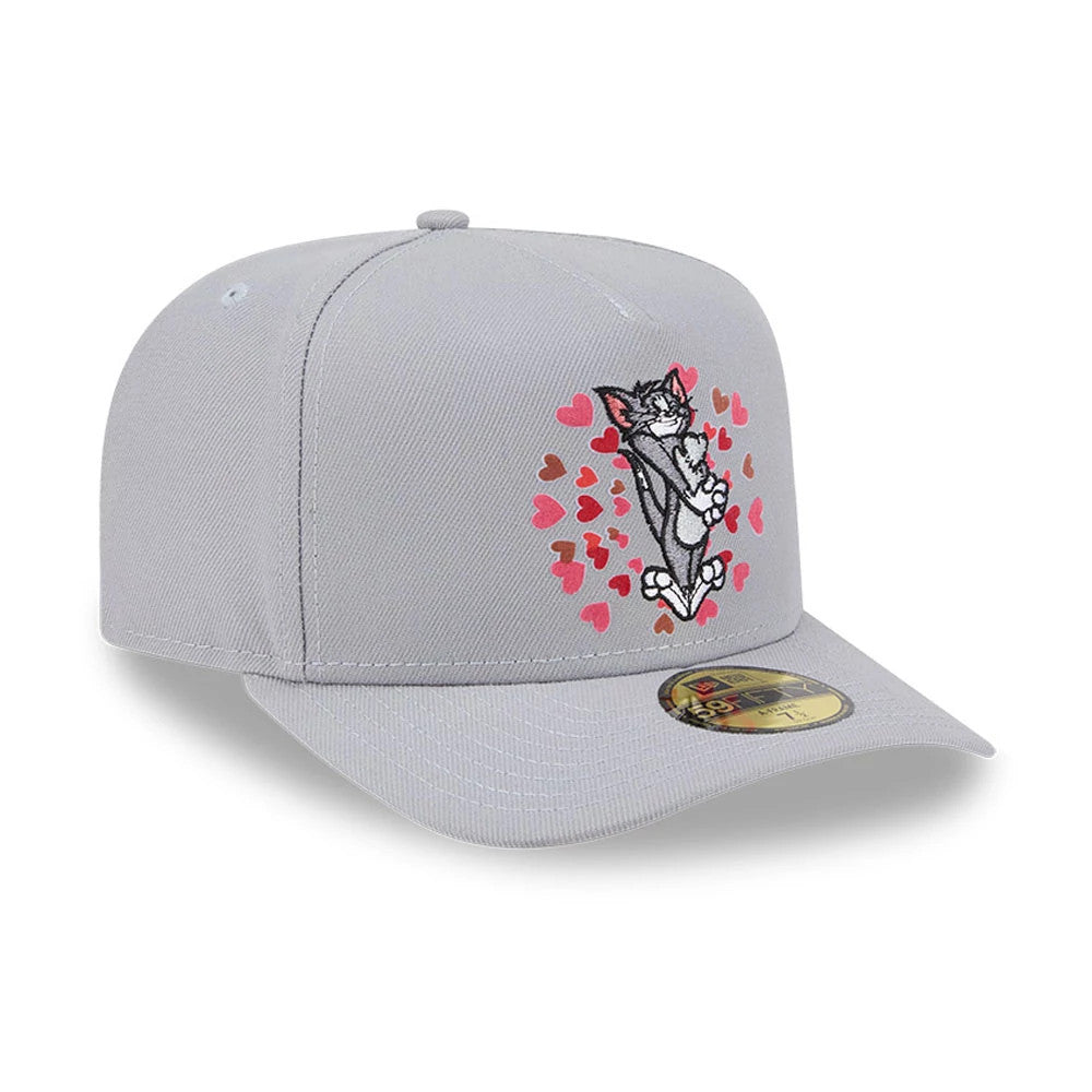Tom & Jerry Love Struck Grey New Era 59FIFTY A-Frame Fitted Cap, front view showing a graphic of Tom surrounded by red hearts on the structured grey crown, with a gold 59FIFTY size sticker on the flat grey visor.