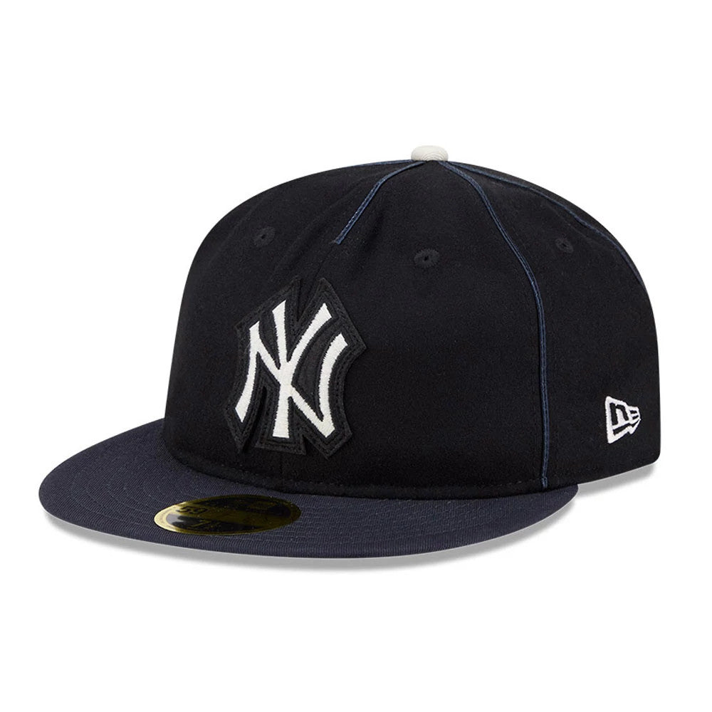 New York Yankees MLB Felt Logo Navy Retro Crown New Era 59FIFTY Fitted Cap, three-quarter view showing the prominent raised white embroidered NY logo on the front panel, navy flat visor with a gold 59FIFTY size sticker.