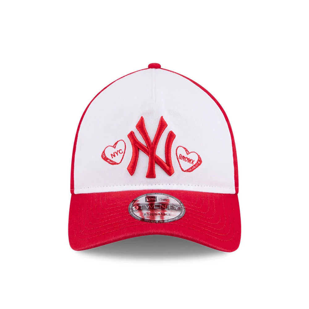 New York Yankees MLB Conversation Hearts Red New Era 9TWENTY A-Frame Adjustable Cap, front view showing the raised red NY logo embroidered on a white front panel between two heart graphics, with a red curved visor and 9TWENTY size sticker.