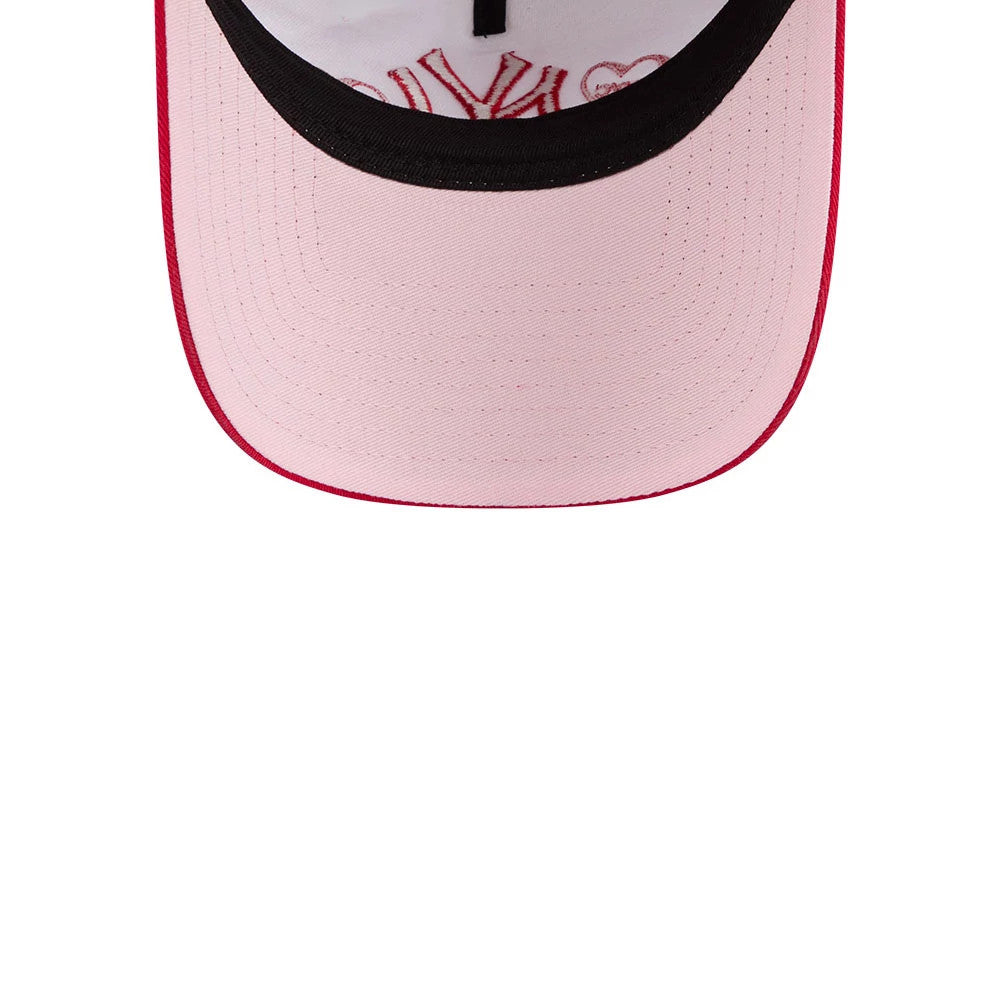 New York Yankees MLB Conversation Hearts Red New Era 9TWENTY A-Frame Adjustable Cap, inside view showing pink undervisor with a black edge, white sweatband with red stitching, and red embroidered motifs featuring the Yankees logo on the interior.