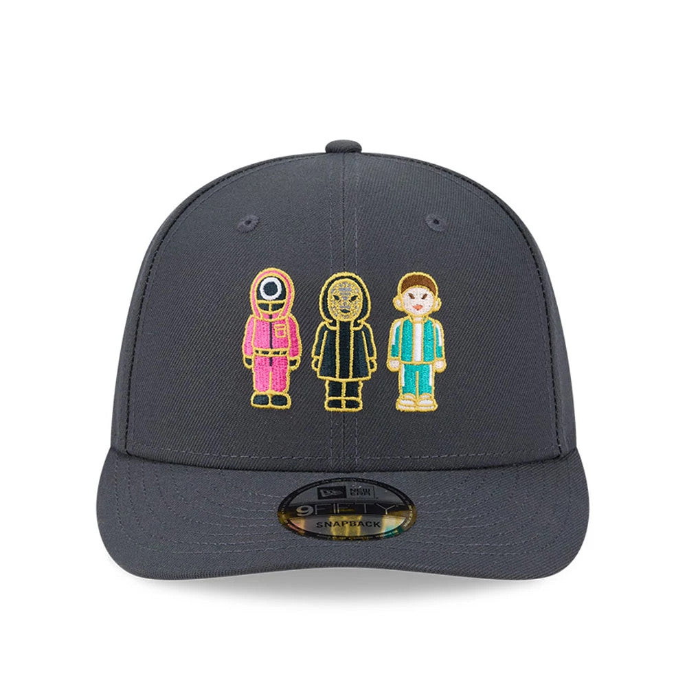 Netflix Squid Game Dark Grey New Era 9FIFTY Snapback Adjustable Cap, front view showing the colourful embroidered characters on the dark grey front panels, black flat visor and 9FIFTY size sticker centrally placed on the visor.