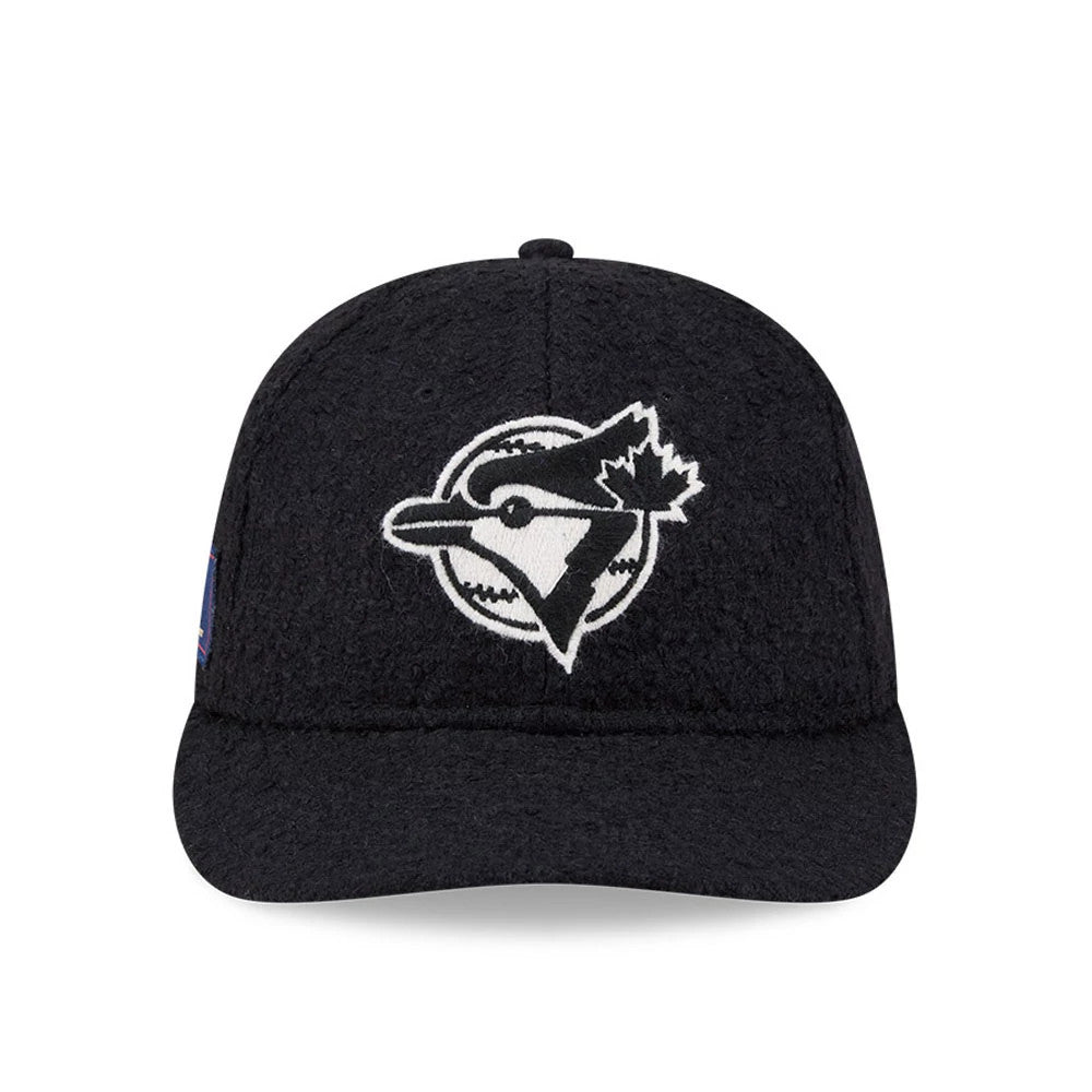 Toronto Blue Jays MLB X Moon Navy Retro Crown New Era 9FIFTY Adjustable Cap, front view showing the white embroidered Blue Jays logo with outlines on the front panel, paired with a navy flat visor and a textured crown.