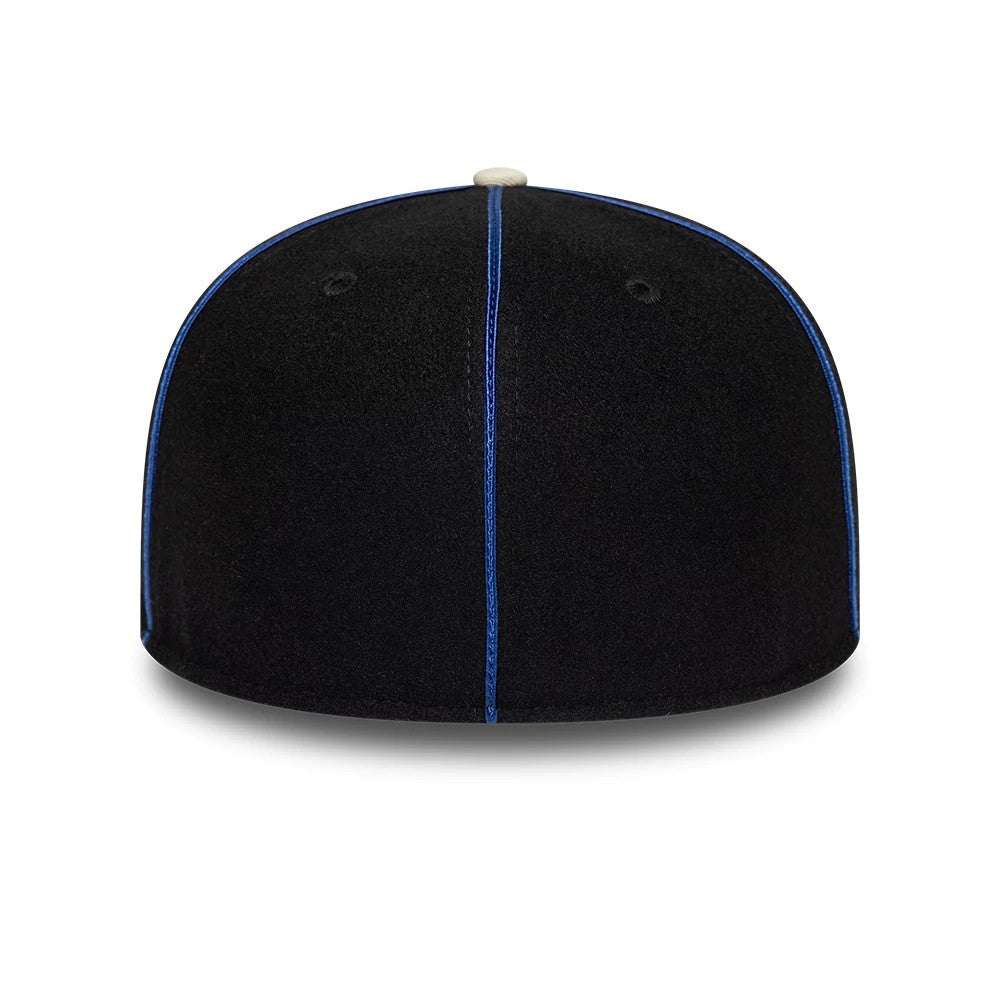 Pictured is this NBA Felt Logo New York Knicks Retro Crown 59FIFTY Fitted cap in dark blue. 7
