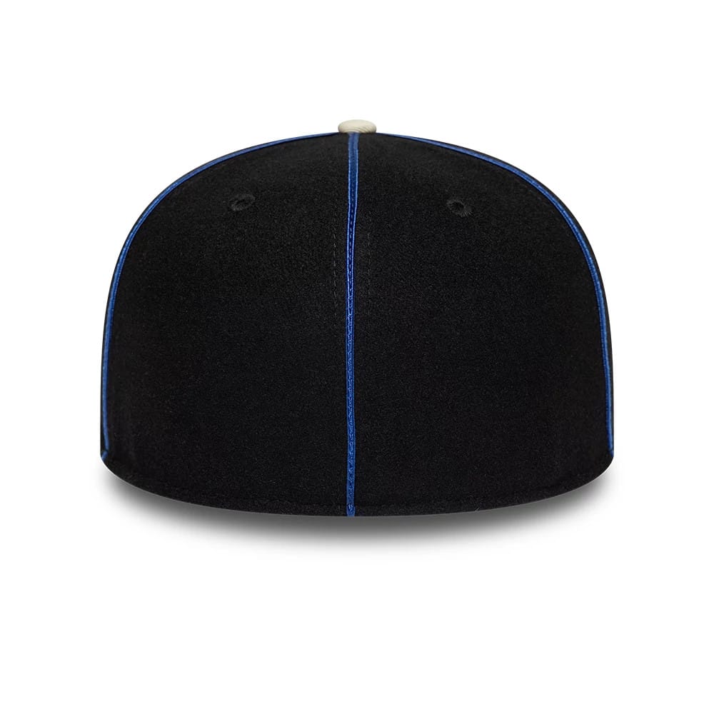 Pictured is this NBA Felt Logo New York Knicks Retro Crown 59FIFTY Fitted cap in dark blue. 7