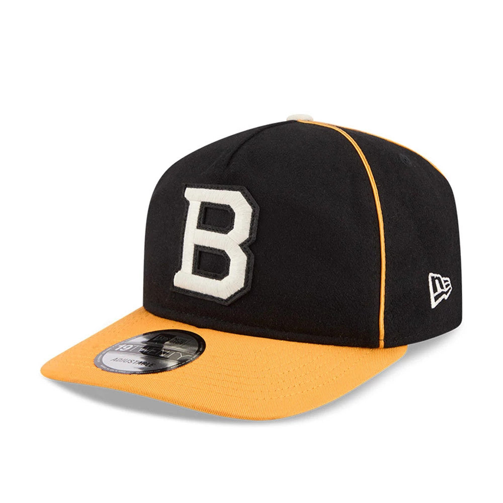 Boston Bruins NHL Felt Logo Black New Era 19TWENTY Adjustable Cap, three-quarter view showing the raised white felt B logo on the front panel, contrasting gold visor with a 19TWENTY size sticker.