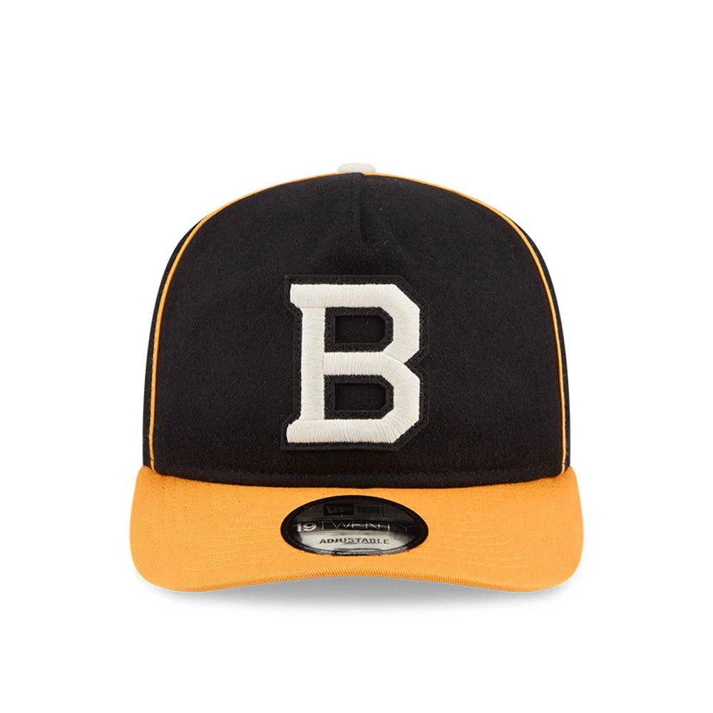 Boston Bruins NHL Felt Logo Black New Era 19TWENTY Adjustable Cap, front view showing the white felt B embroidered on the black crown, with yellow piping along the seams and an orange visor, featuring a 19TWENTY size sticker.