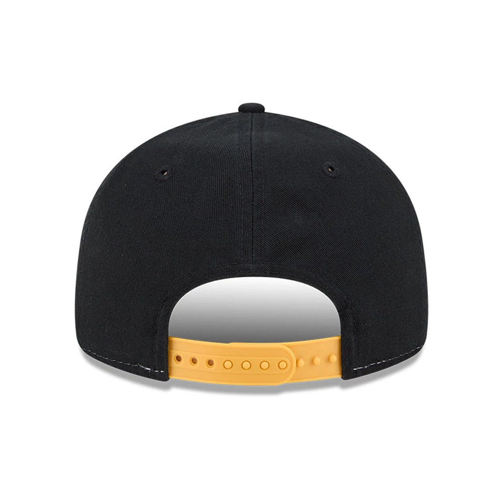Bruins NHL Team Stripes Black Retro Crown New Era 9FIFTY Adjustable Cap, rear view showing the simple black back panels with two black eyelets on each side, complemented by a yellow adjustable strap and a top button.