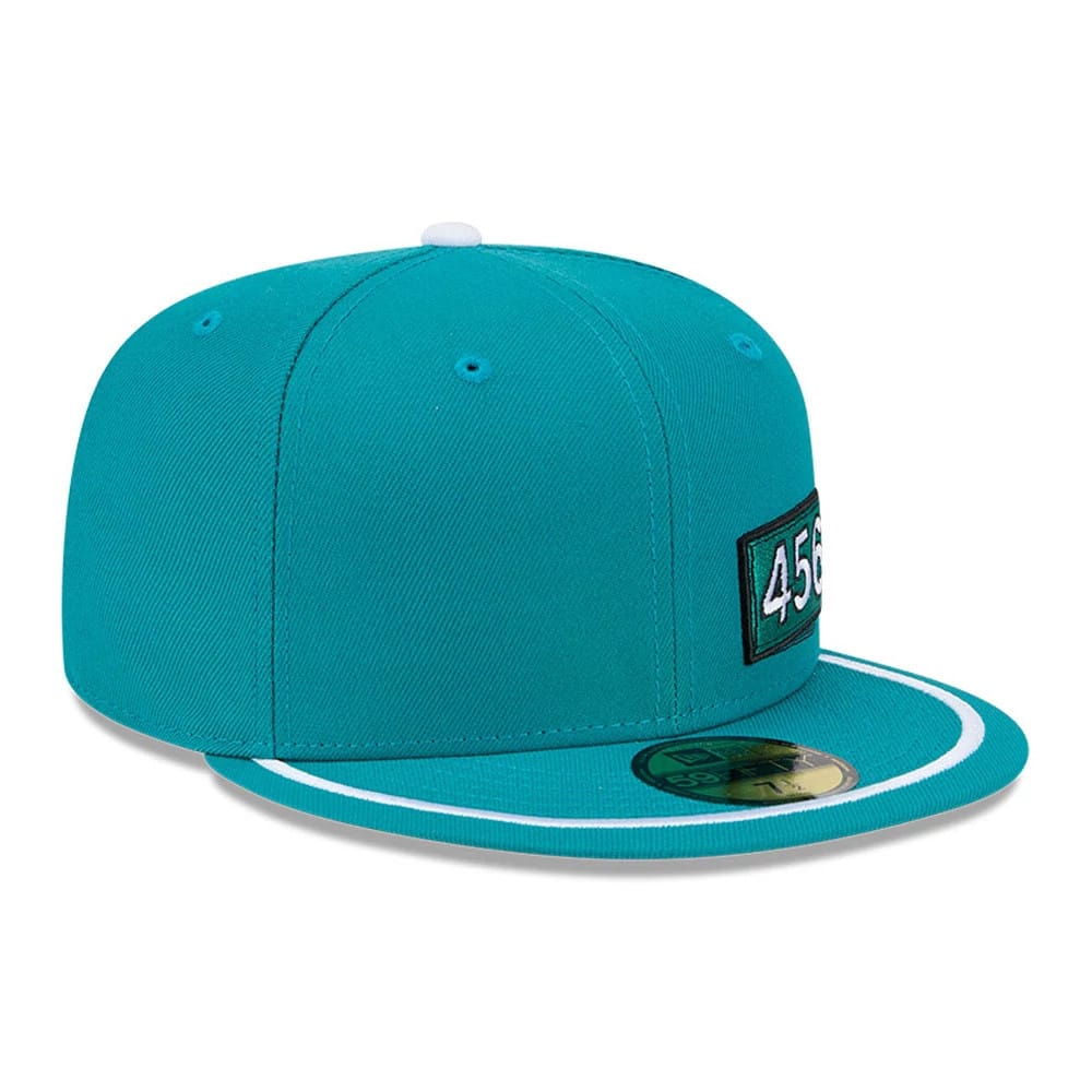 Netflix Squid Game 456 Patch Green New Era 59FIFTY Fitted Cap, three-quarter view showing the raised black 456 patch embroidered on the structured green crown, with a matching green flat visor featuring white trim and a gold 59FIFTY size sticker.