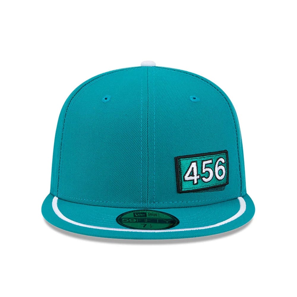 Netflix Squid Game 456 Patch Green New Era 59FIFTY Fitted Cap, front view showing the black embroidered 456 patch on the right front panel, a green visor with white trim, and the gold 59FIFTY size sticker underneath.