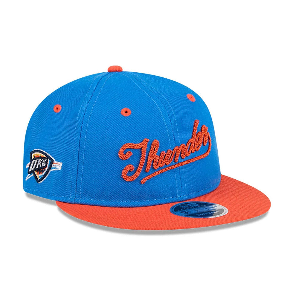 OKC Thunder NBA Chainstitch Script Blue Retro Crown New Era 9FIFTY Adjustable Cap, front view showing orange chainstitch embroidery of Thunder on blue crown, bright orange flat visor with 9FIFTY size sticker, and OKC logo on the left side.