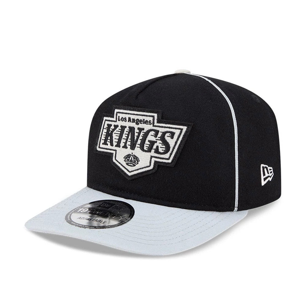 LA Kings NHL Felt Logo Black New Era 19TWENTY Adjustable Cap, front view showing the large white felt Kings logo embroidered on the black crown, a grey visor with a 19TWENTY size sticker, and a white New Era flag logo on the left side.
