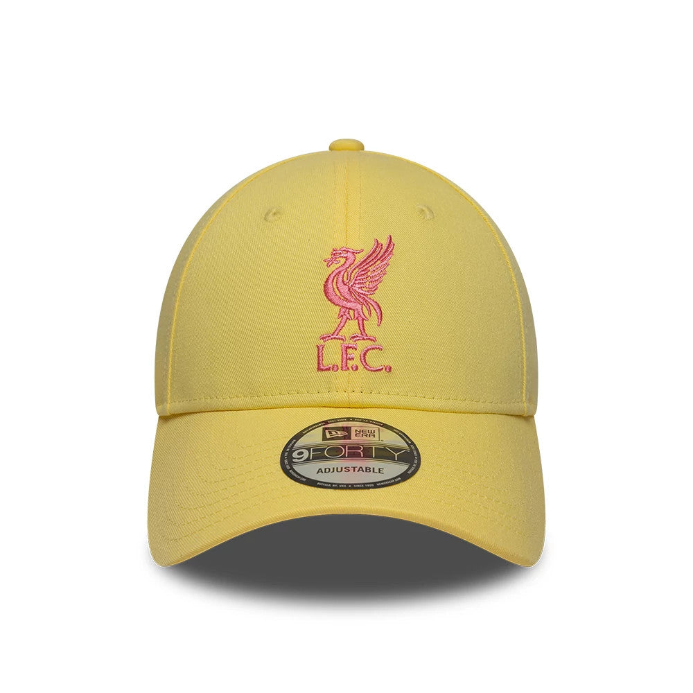 Liverpool FC Womens Pastel Yellow New Era 9FORTY Adjustable Cap, front view showing the pink embroidered L.F.C. Liverbird logo on the structured pastel yellow crown, with a curved visor and the 9FORTY size sticker.