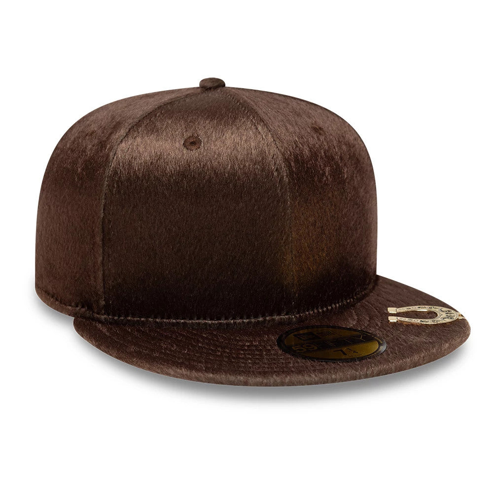 New Era Faux Pony Dark Brown 59FIFTY Fitted Cap, three-quarter view showing a textured faux pony finish across the dark brown crown, a gold 59FIFTY size sticker on the flat matching visor, and a top button in the same material.
