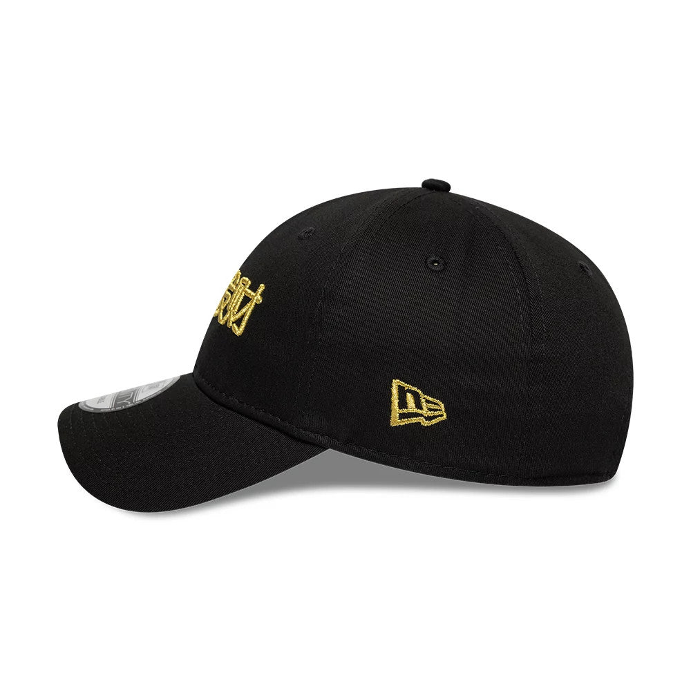 New Era Lunar New Year Black 9TWENTY Adjustable Cap, side view showing a gold embroidered New Era flag logo on the left side, a curved black visor and the main gold embroidery on the front panel.