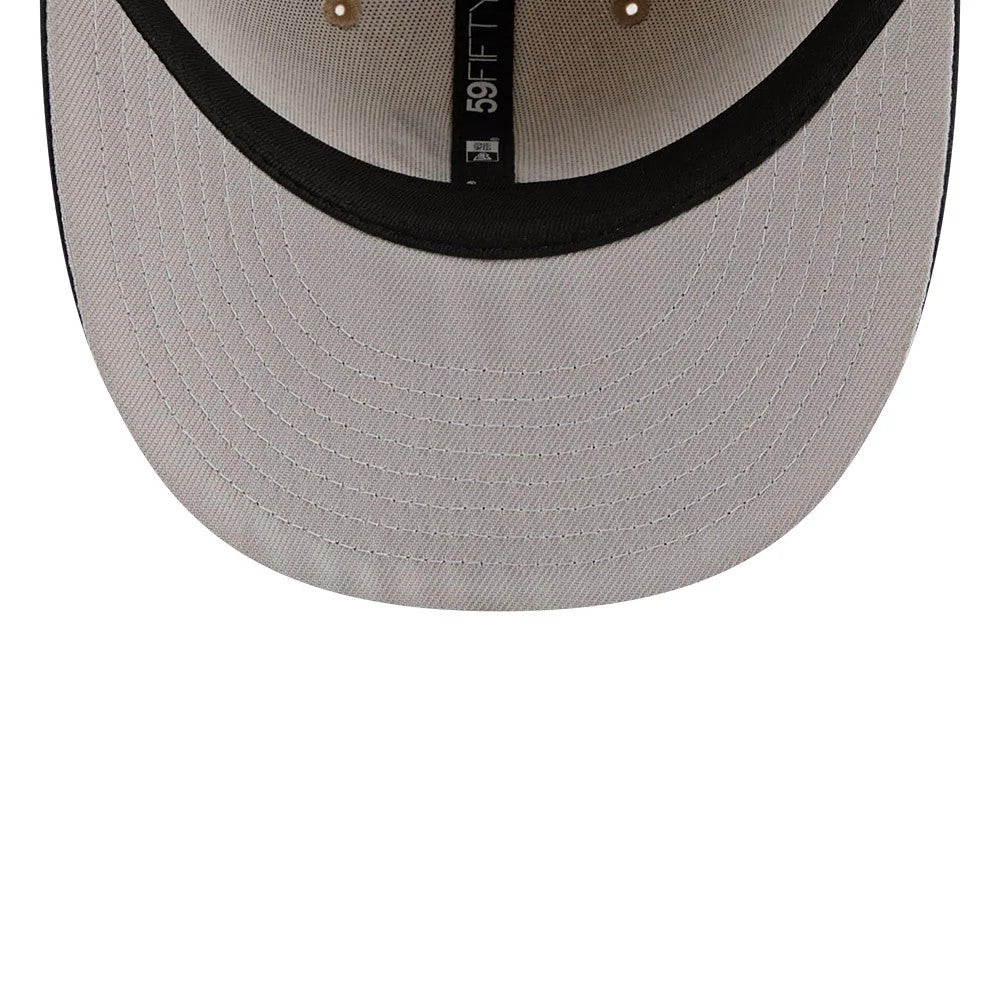 Atlanta Braves MLB Twine Beige New Era 59FIFTY Fitted Cap, inside view showing a light grey undervisor, black internal taping with the 59FIFTY logo, and eyelets on the beige panels under the structured crown.