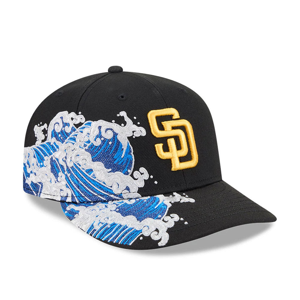 San Diego Padres MLB Vissurf Black New Era 9FIFTY Snapback Adjustable Cap, three-quarter view showing the gold embroidered SD logo on the black front panel, with a blue and white wave graphic wrapping around the side and visor.