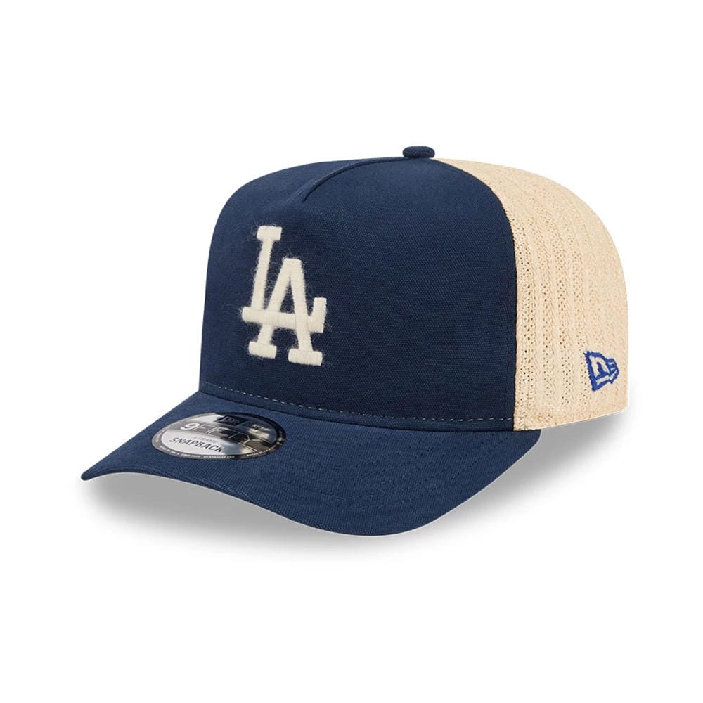 Pictured is this MLB Grained LA Dodgers 9FIFTY A-Frame Snapback cap in dark blue. 1