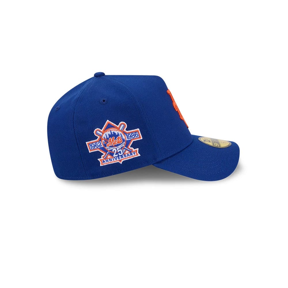 New York Mets MLB Team Side Blue New Era 59FORTY A-Frame Fitted Cap, side view showing the orange Mets anniversary logo embroidered on the side panel, a structured blue crown with eyelets, and a blue curved visor with the gold 59FORTY size sticker.