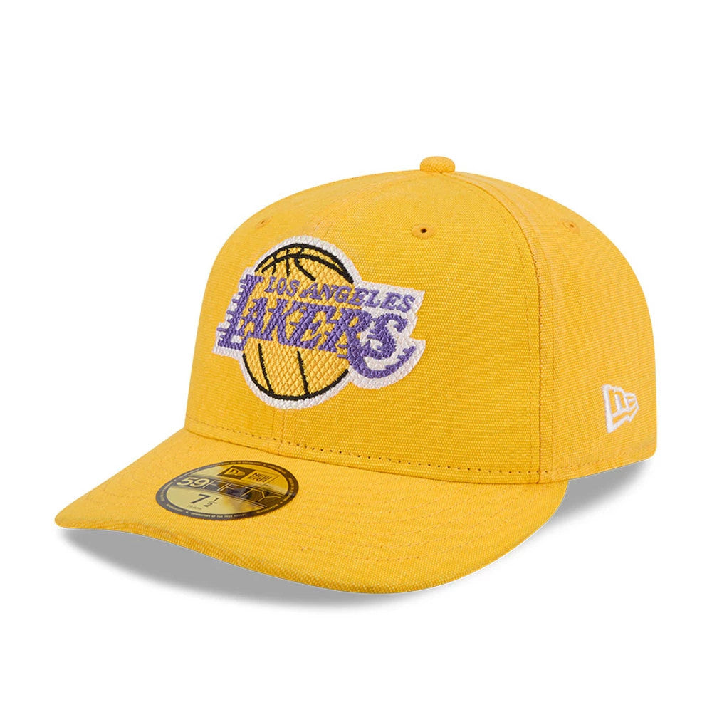 LA Lakers NBA Hardwood Classic Yellow New Era 59FIFTY Fitted Cap, three-quarter view showing the raised purple and white embroidered LA Lakers logo on the structured yellow front panel, with a gold 59FIFTY size sticker on the flat visor.