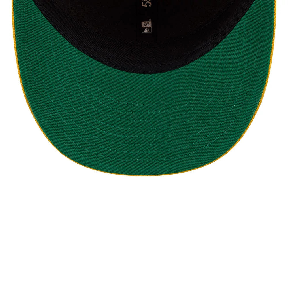 LA Lakers NBA Hardwood Classic Yellow New Era 59FIFTY Fitted Cap, inside view showing the black sweatband with a size sticker, the green undervisor with its neat yellow edge, and black taping along the seams.