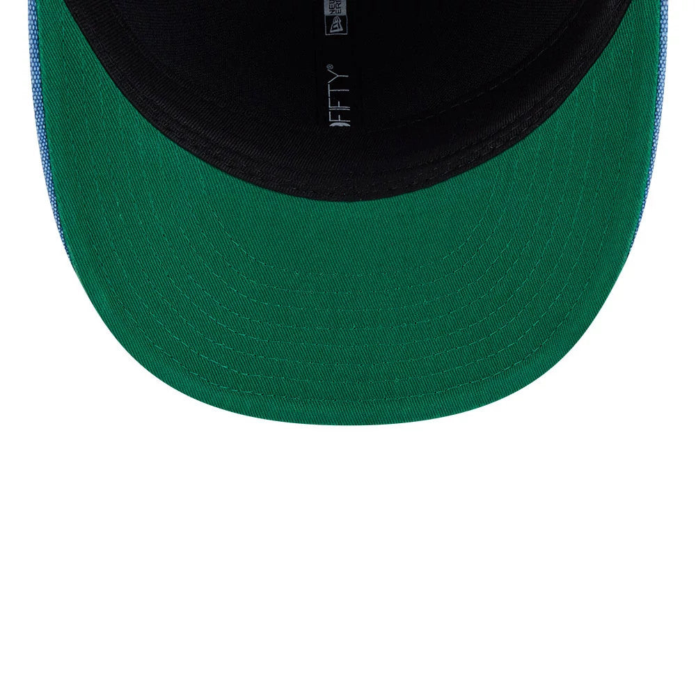 Warriors NBA Hardwood Classic Blue New Era 59FIFTY Fitted Cap, inside view showing the green undervisor contrasting with the black interior, along with the 59FIFTY logo on the black taping.