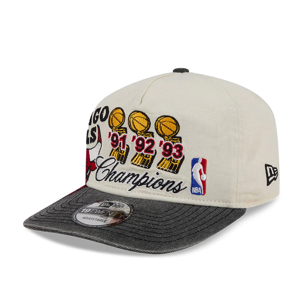 Chicago Bulls NBA Hardwood Classic Cream New Era 19TWENTY Adjustable Cap, three-quarter view showing the embroidered trophies with ‘91 ‘92 ‘93 in gold on the front panel, a grey visor with 19TWENTY size sticker, and red Bulls logo.