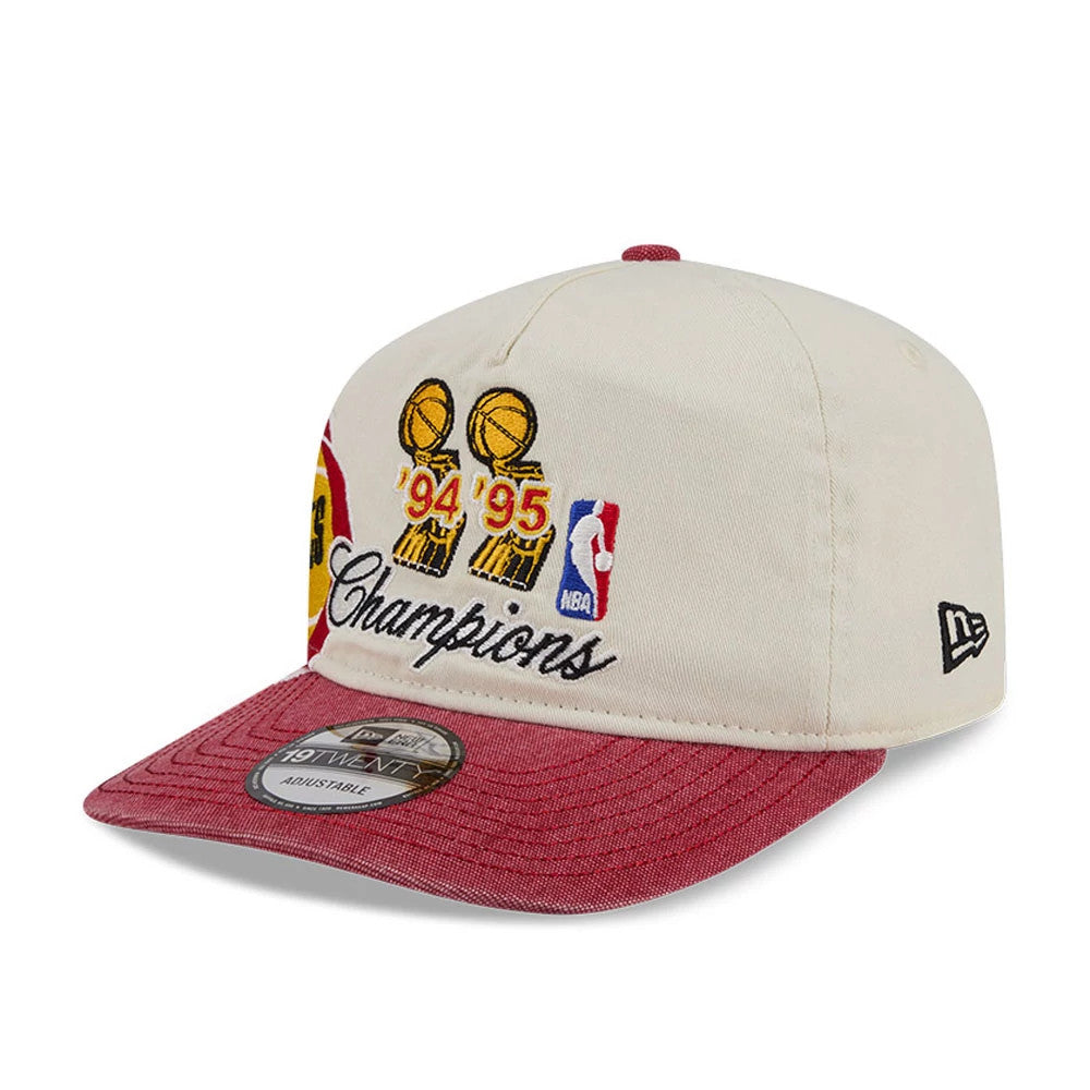 Houston Rockets NBA Hardwood Classic Red New Era 19TWENTY Adjustable Cap, three-quarter view showing embroidered '94 '95 trophies and Champions script on the front panel, with red visor, grey undervisor, and New Era flag logo on the left side.