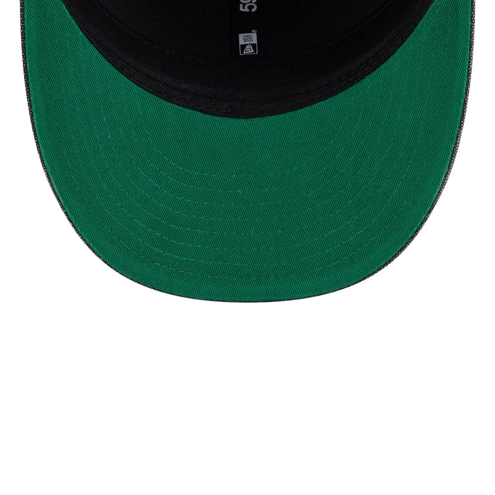 Bulls NBA Hardwood Classic Black New Era 59FIFTY Fitted Cap, inside view showing a green undervisor, matte black sweatband with white size markings, and taping featuring brand details along the inside of the structured crown.