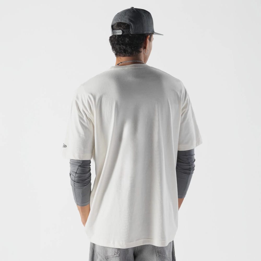 The model is wearing this Rick And Morty Spaceship T-Shirt in cream. 2