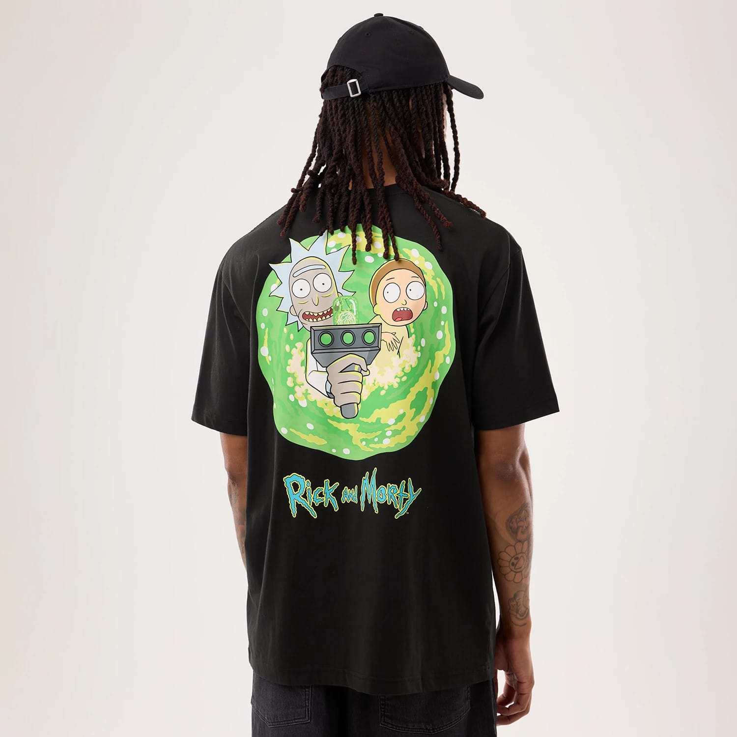 The model is wearing this Rick And Morty Portal Gun T-Shirt in black. 2