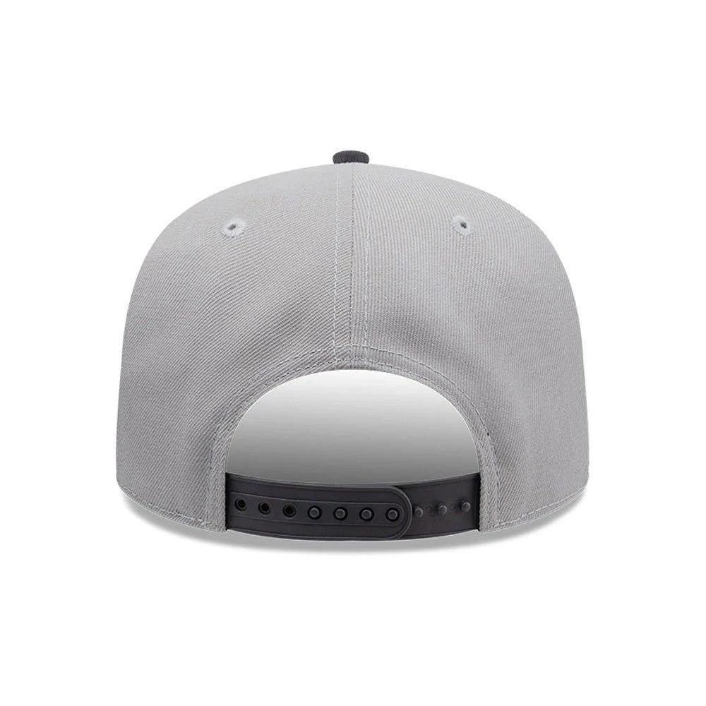 Chicago White Sox MLB Tagged Grey New Era 19TWENTY Cap, rear view showing a black adjustable strap closure, grey structured crown with two ventilated eyelets on each side, and a black top button at the crown's apex.