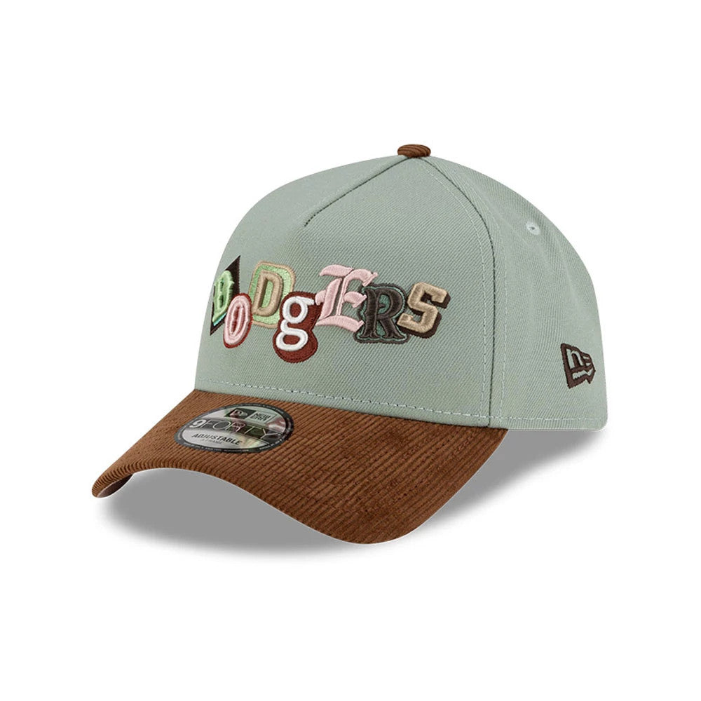 LA Dodgers MLB DIY Note Green New Era 9FORTY A-Frame Cap, three-quarter view showing the multicoloured embroidered Dodgers letters across the front panel, a brown corduroy curved visor, and the New Era flag logo on the left side.