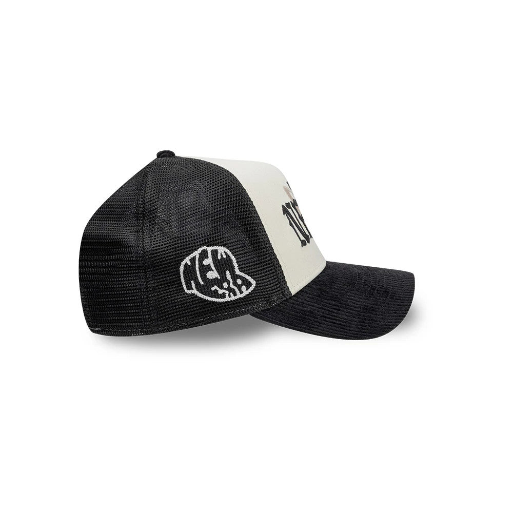 New Era Old English White 9FORTY A-Frame Cap, side view showing the white embroidered New Era logo on the black mesh side panel, a structured white front panel with black lettering, and a curved black visor.