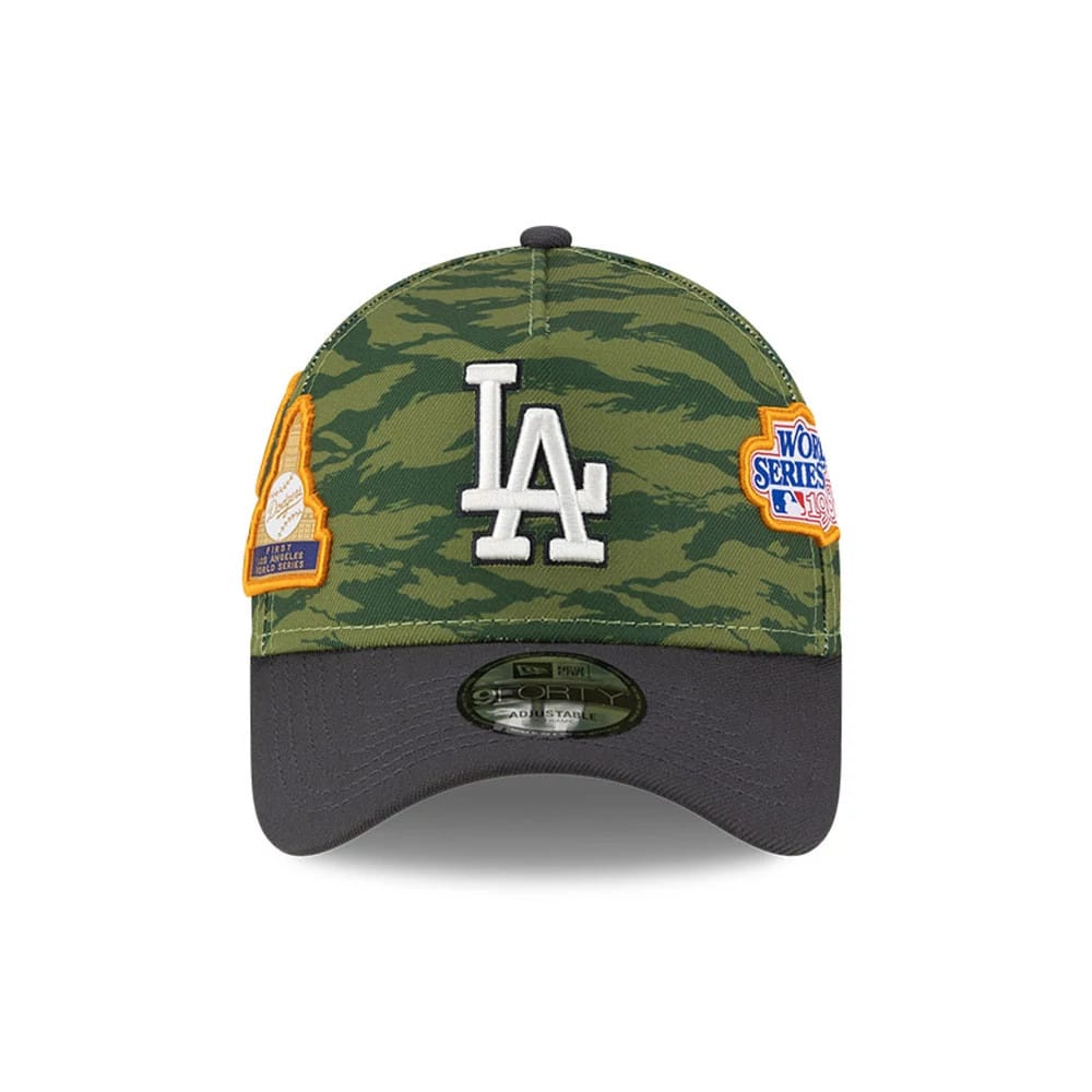 LA Dodgers MLB Tiger Camo Green New Era 9FORTY A-Frame Cap, front view showing a white embroidered LA logo on the structured camouflage crown, with a black visor and a 9FORTY size sticker, featuring side World Series patches.